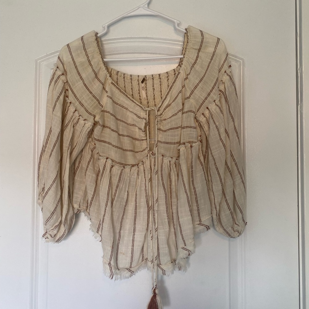 NEED TO SELL ASAP!!! Long sleeve with tie in the front. Super cute.